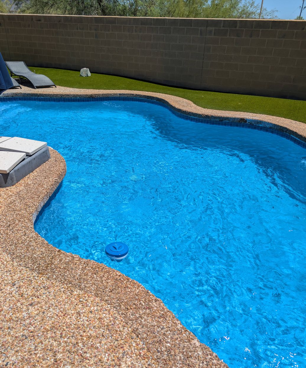 beautiful clean pool with sparkling blue water and pristine tile