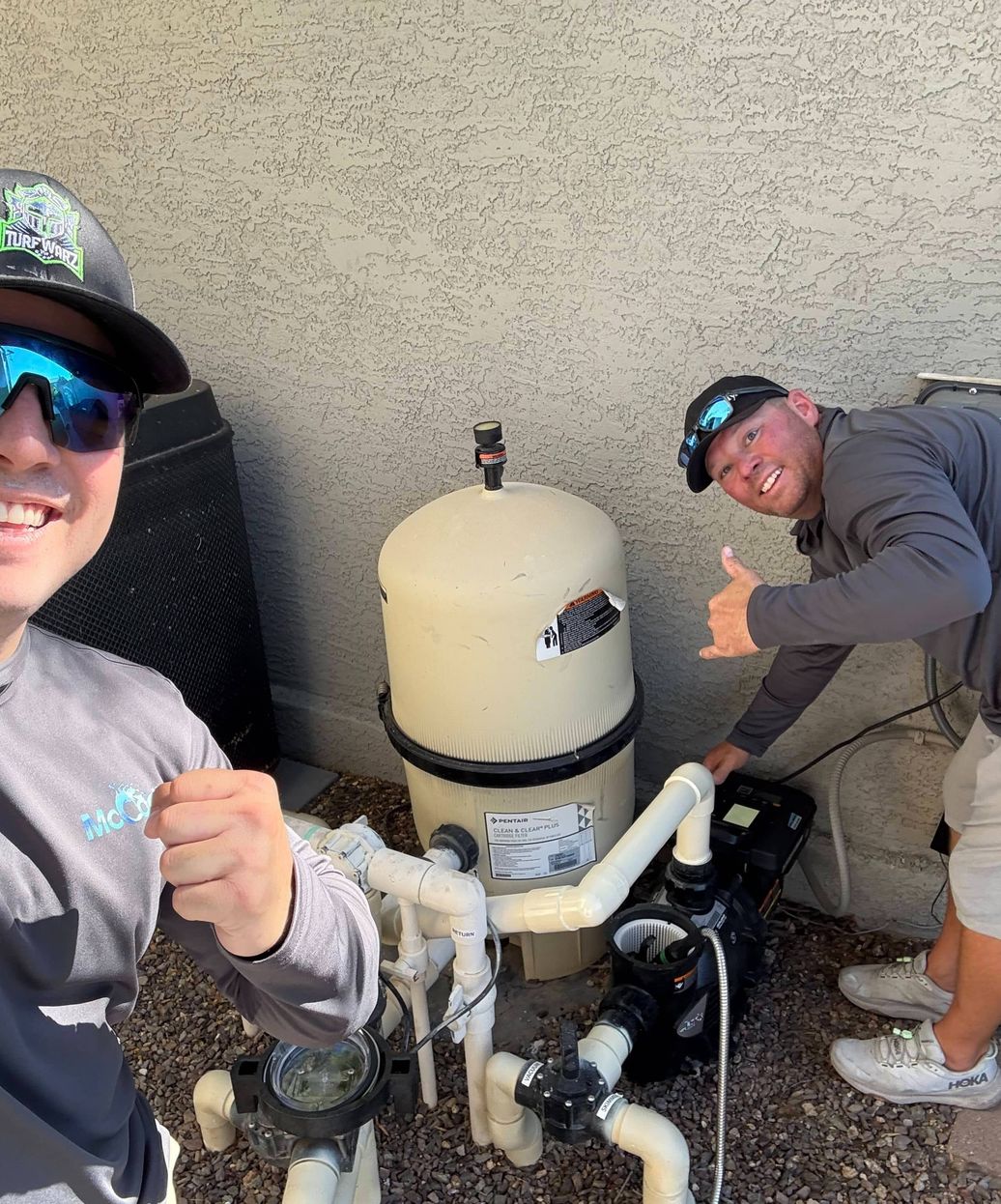 pool technicians with newly installed variable speed pump